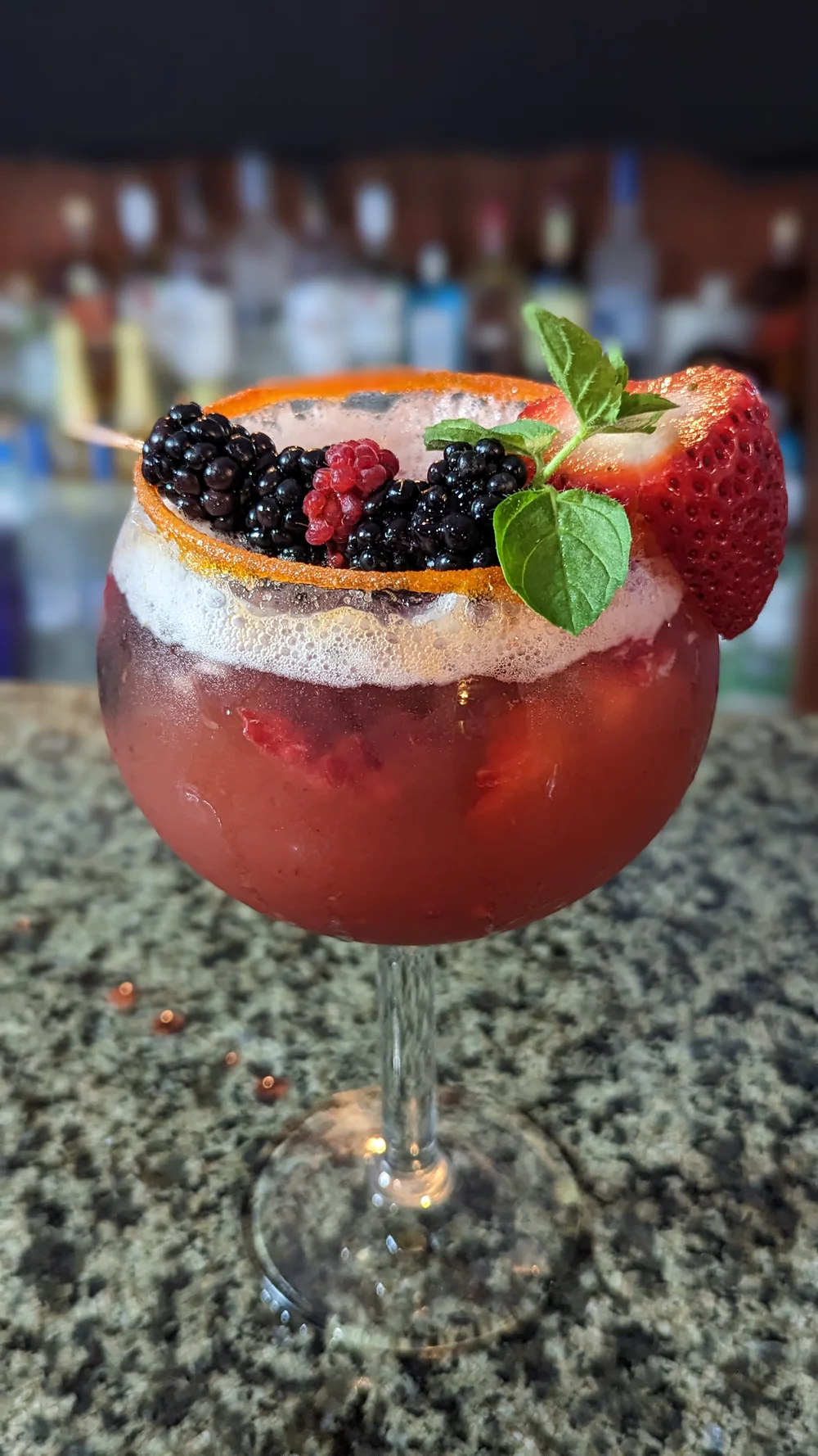 Berry cocktail with fresh fruit garnish at Lavender Blue